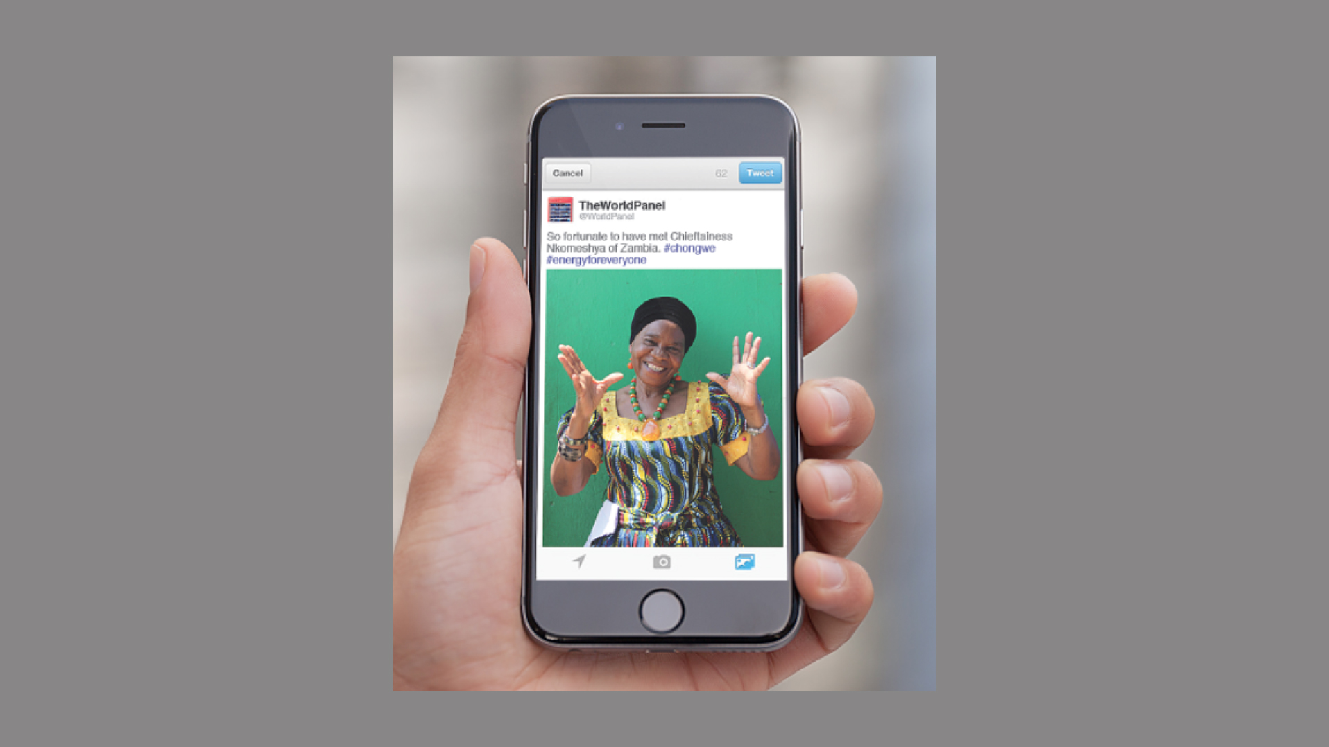 World Panel social media post on a phone screen: a tweet from @WorldPanel with a photo of Chieftainess Nkomeshya of Zambia and the text “So fortunate to have met Chieftainess Nkomeshya of Zambia. #chongwe #energyforeveryone”