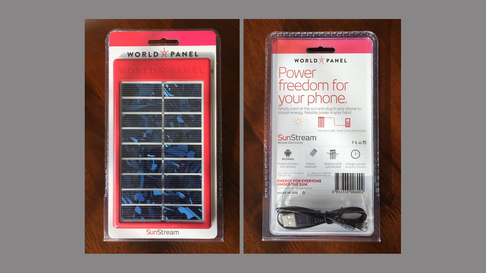 World Panel SunStream packaging: front and back of a retail blister pack on a wooden table, showing the World Panel logo, the red portable solar charger with a USB cable, and the headline “Power freedom for your phone.”