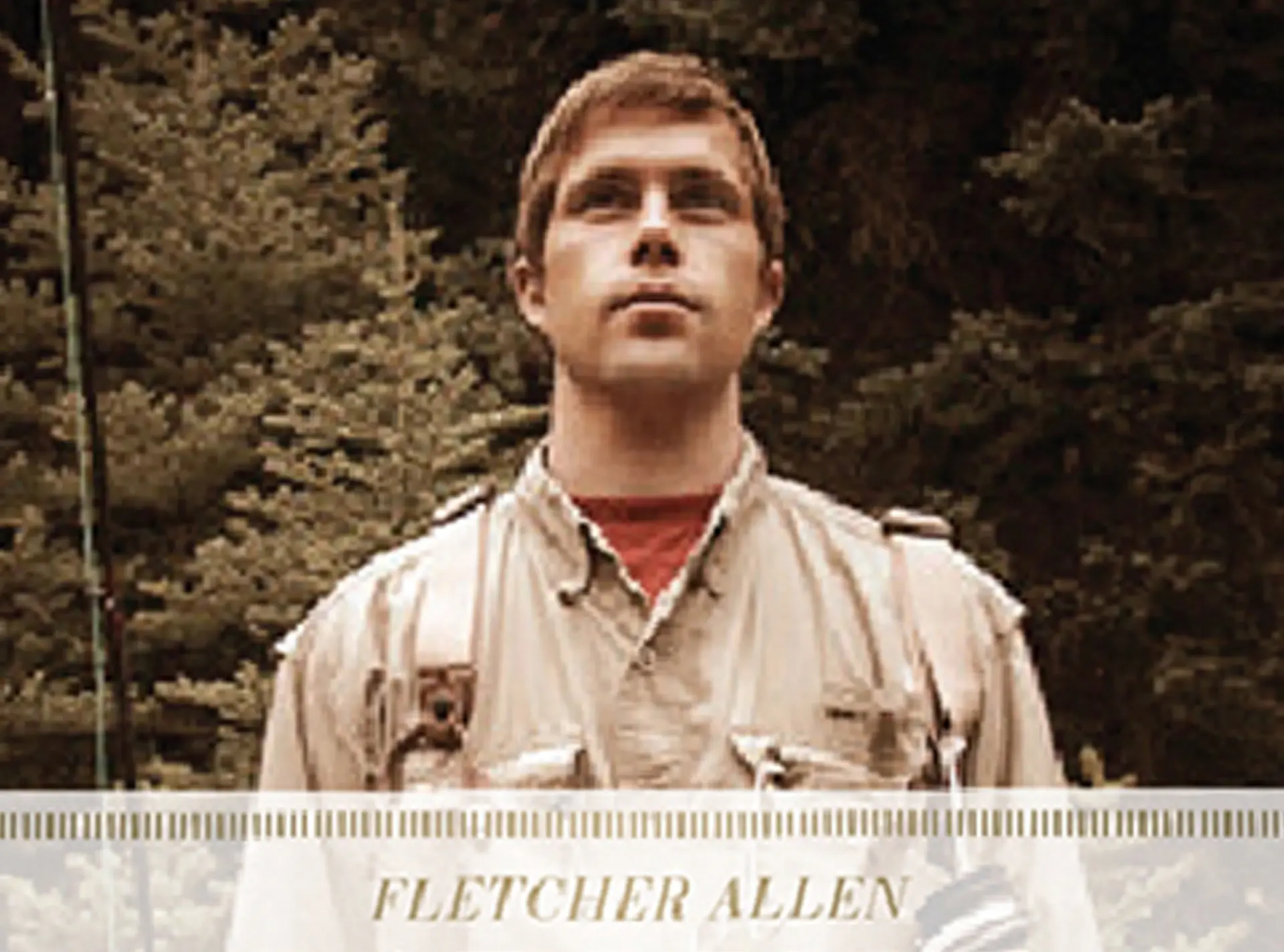Fletcher Allen Health Care: a young angler in wading gear before pine trees, with the name set in a translucent banner below a row of tick marks